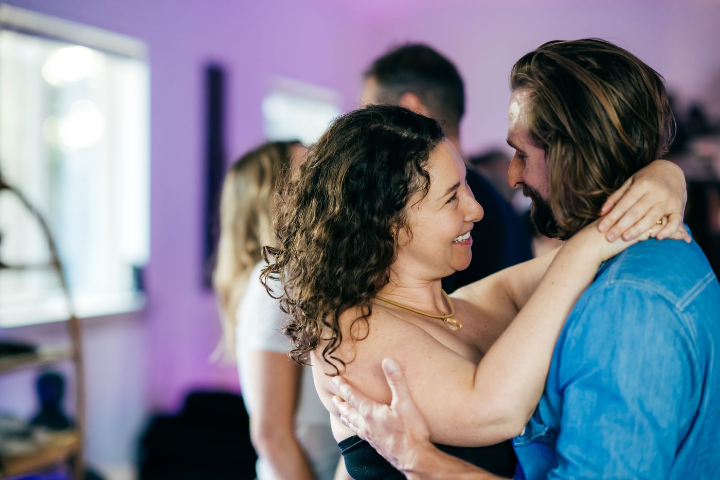 Option C: a couple dancing close at the Austin event.