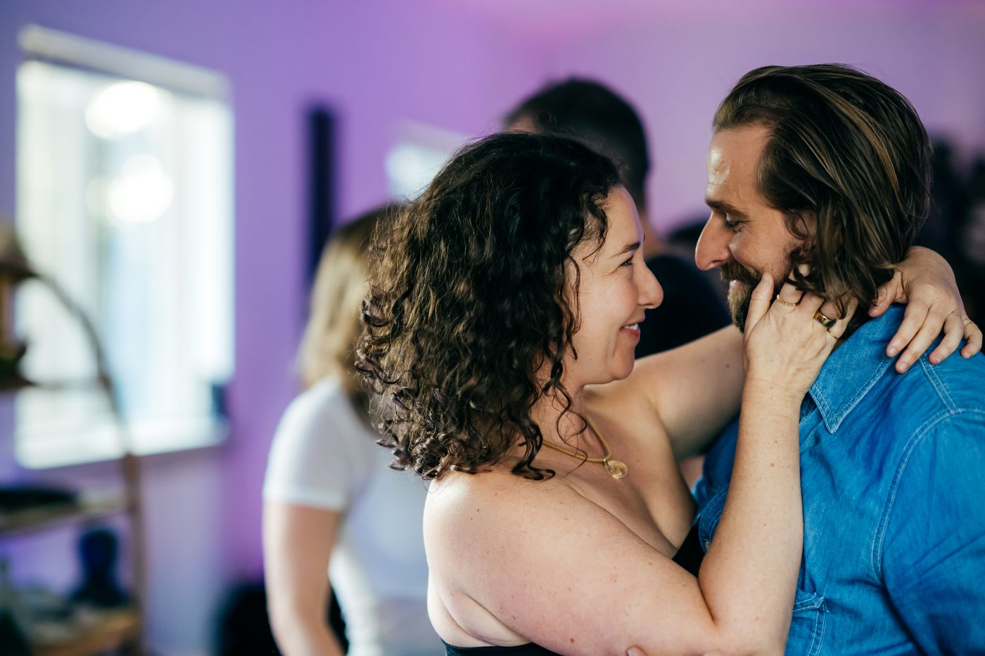 Option C: a couple laughing in each other's arms at the Austin event.