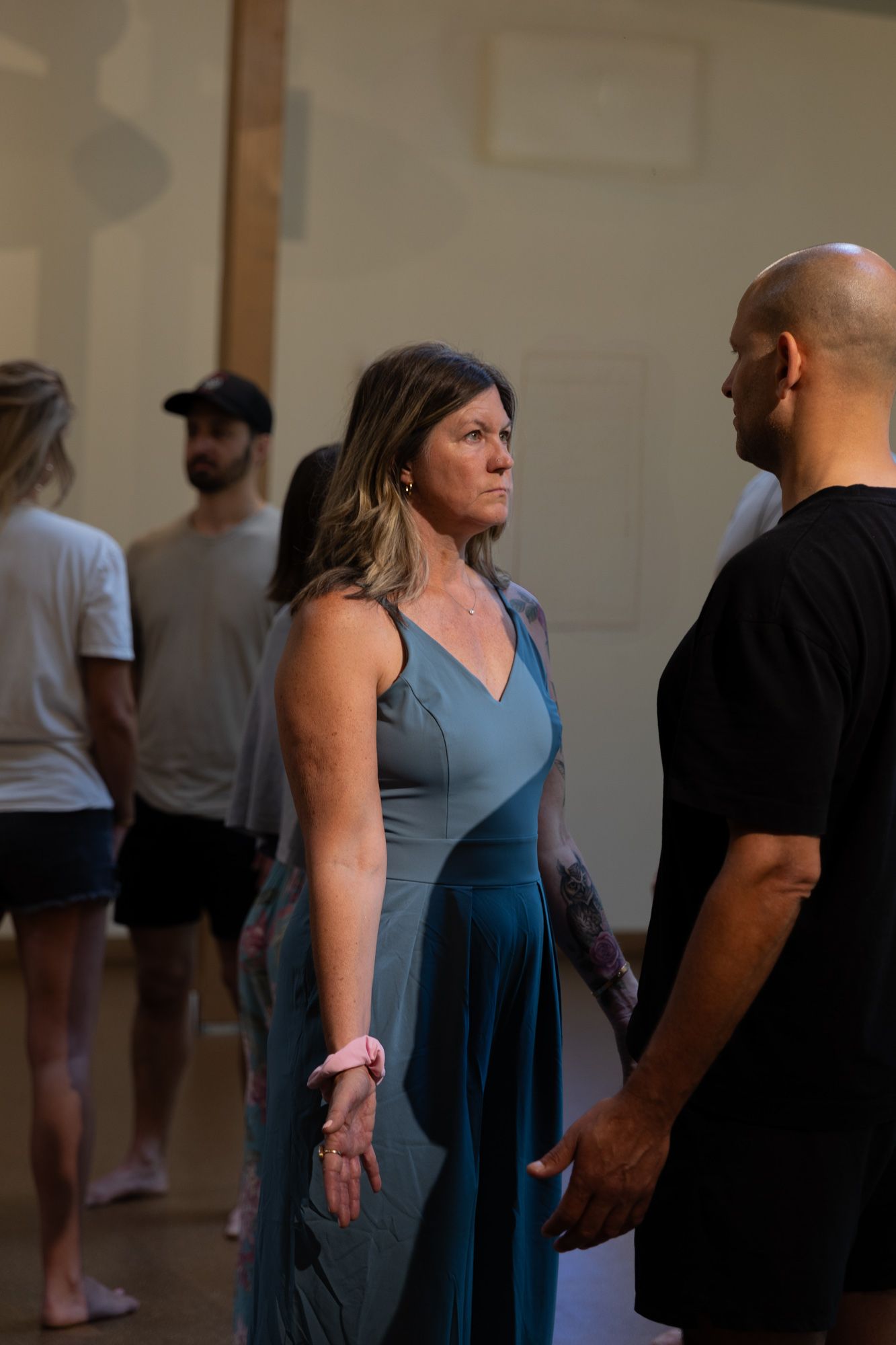 Option C: two participants standing face to face in stillness.