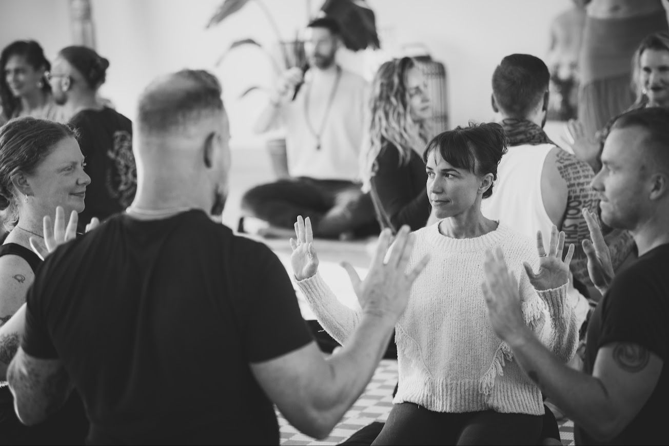 Participants practicing together in the workshop room.